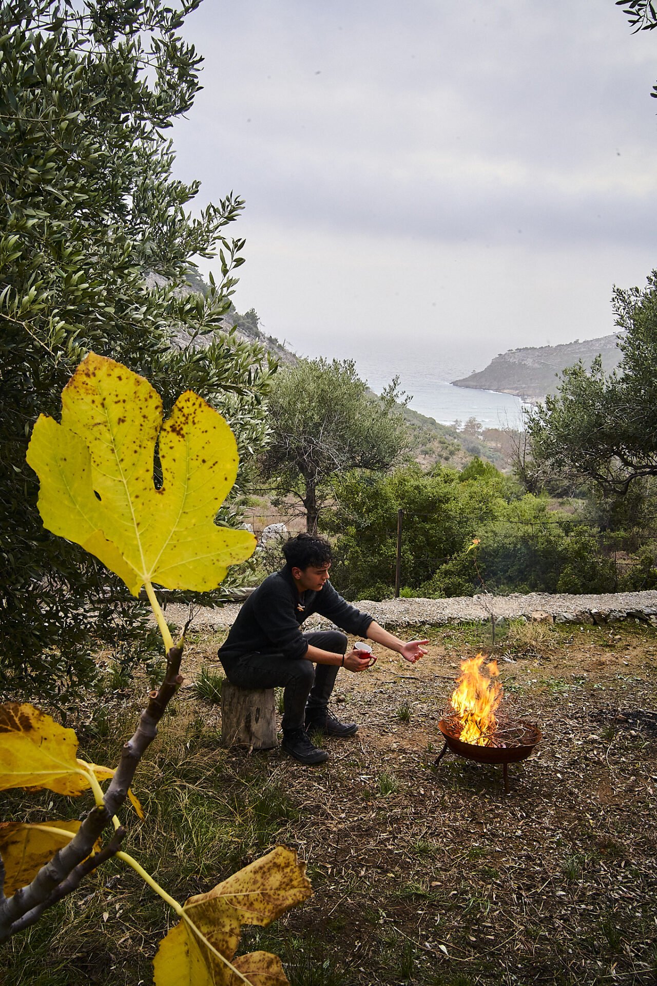 Boy Enjoying Thymonia Valley Glamping Resort Fire Pit Common Area